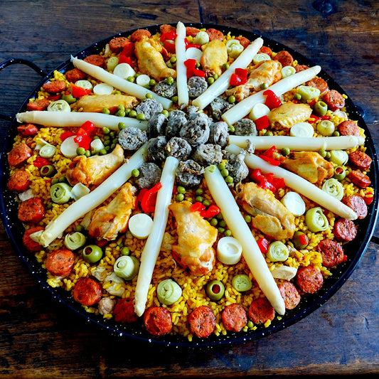 Deluxe paella. Set of six for 75 guests. Paella 3. Handmade South African style sausage, chicken, Colombian chorizo, Burgos morcilla, white asparagus, artichoke hearts, hearts of palm.
