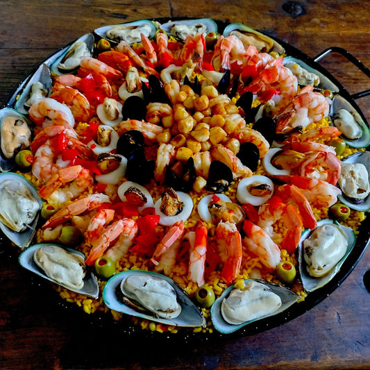Deluxe paella. Set of six for 75 guests. Paella 4. Green lip New Zealand mussels, Jumbo red shrimp. calamari rings, blue mussels, Patagonian shrimp, butter seared bay scallops.