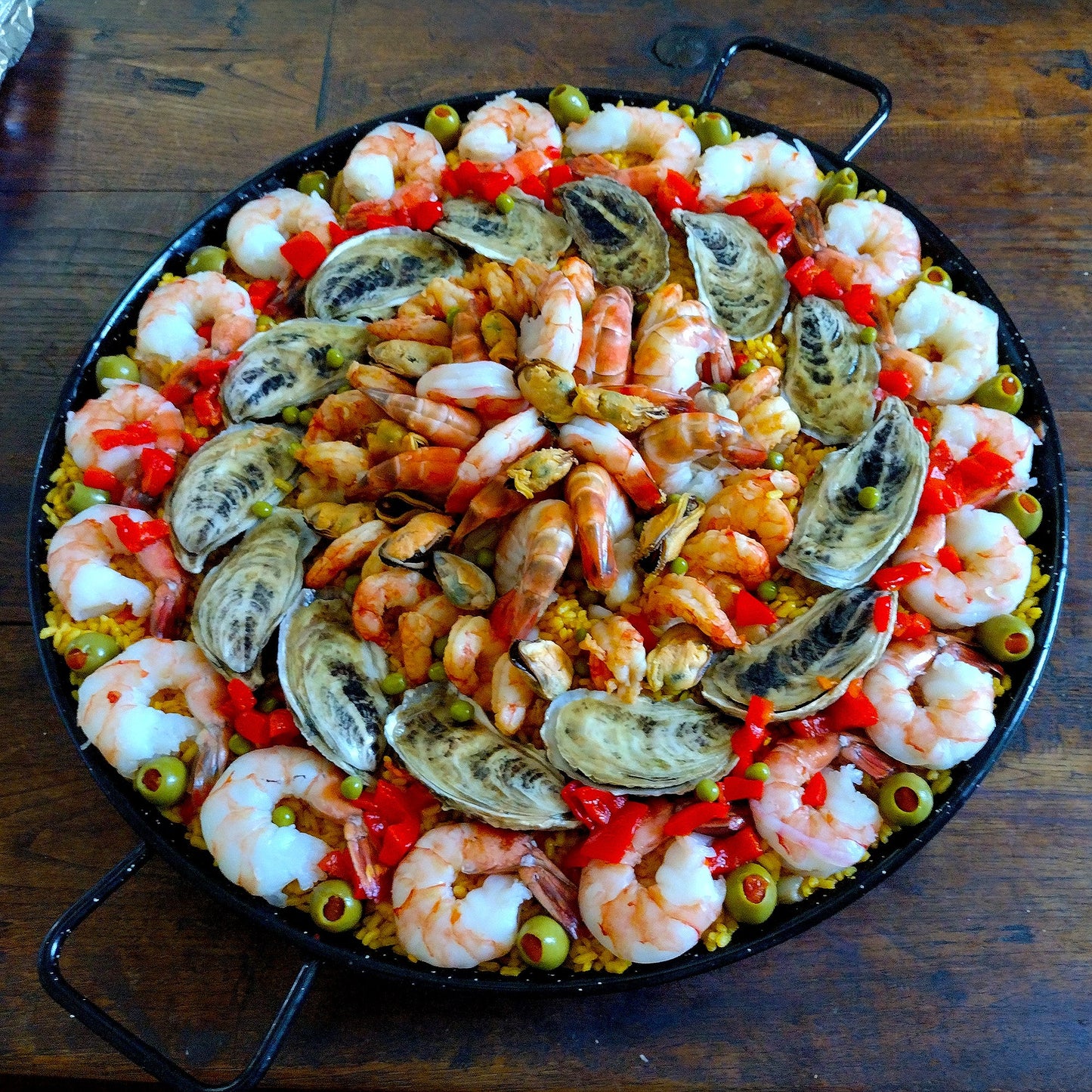 Deluxe paella. Set of six for 75 guests. Paella 5. Key West pink shrimp, local Sebastian Inlet hand-smoked oysters, shrimp fountain with Argentine red, Black Tiger and colossal freshwater prawns.