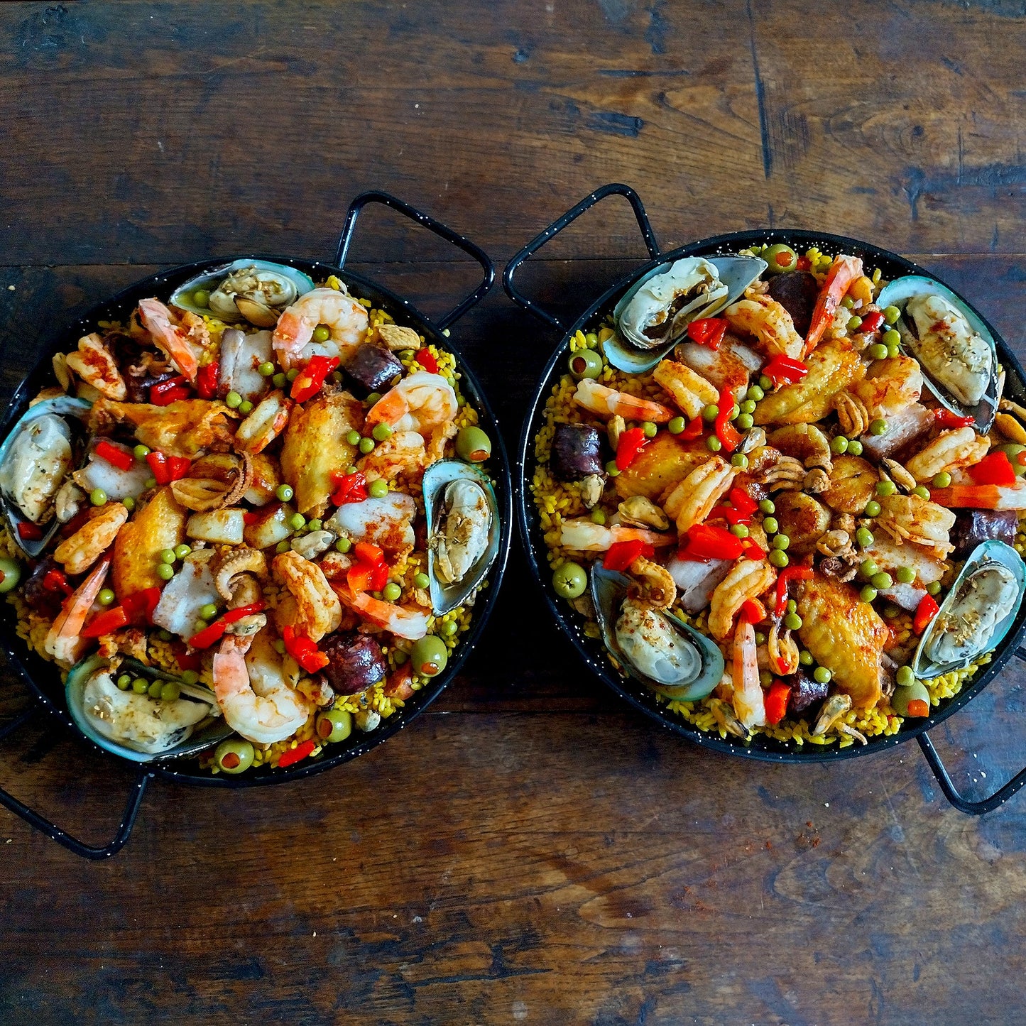 Seafood porkbelly morcilla chicken chorizo paella duo for 8 guests