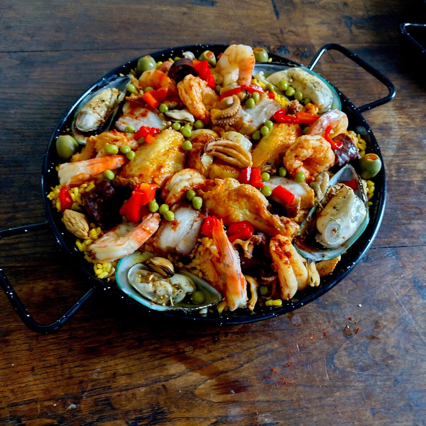 Seafood porkbelly morcilla chicken chorizo paella for 4 guests.