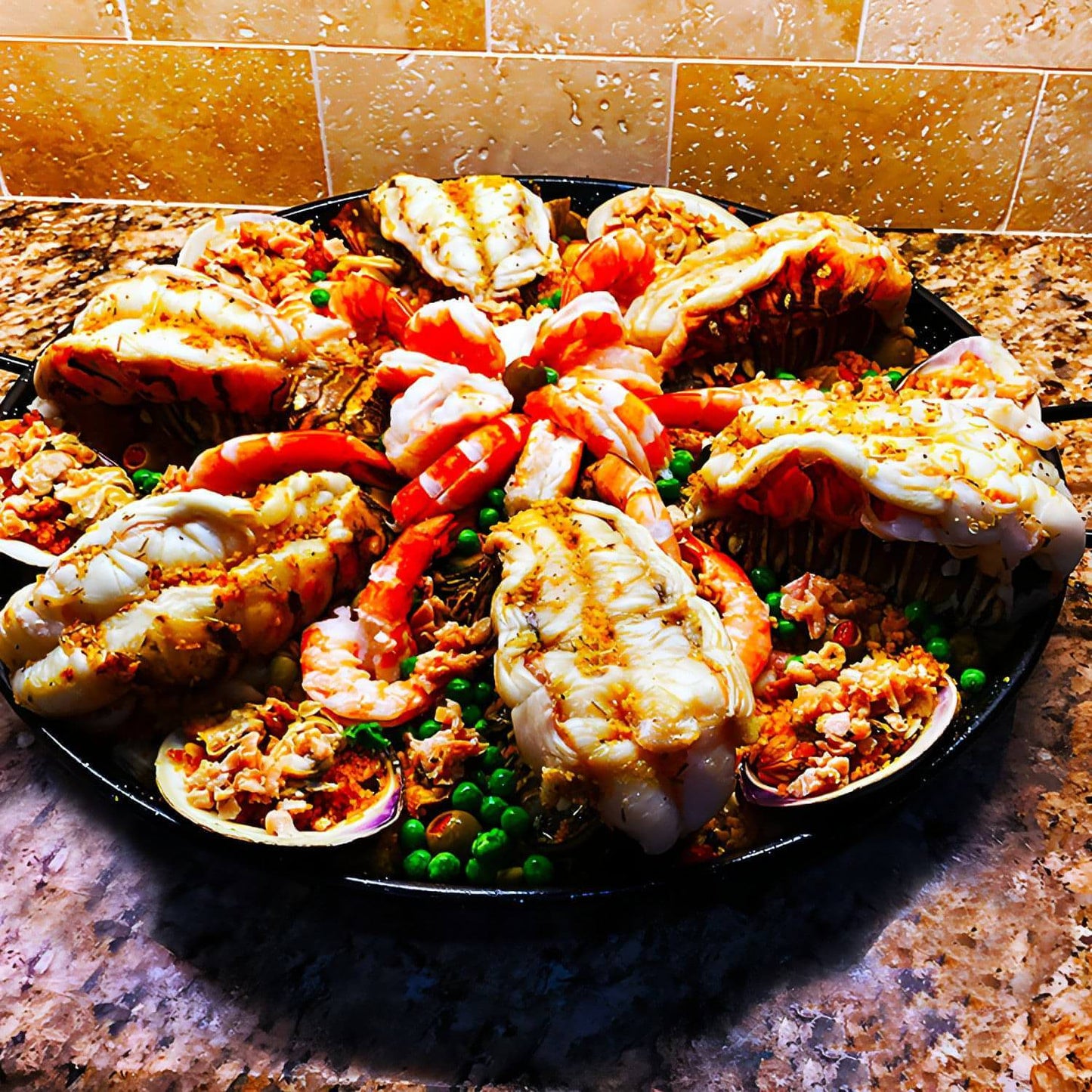 Paella de Langosta Key West Especial - Special paella. Key West lobster tails, stuffed Cherry clams and colossal shrimp fountain.